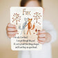 Child holds up affirmation card from Slumberkins Fox Snuggler - Maple / Brown