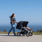 Mother Pushing Children in Bumbleride 2022 Indie Twin Stroller - Black