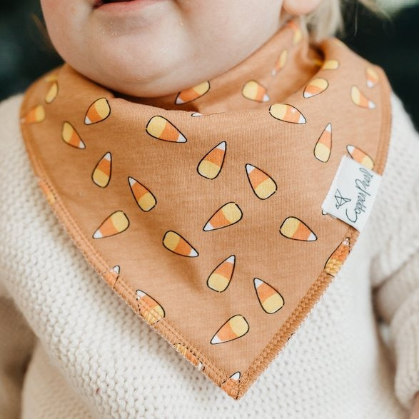 Baby wearing Copper Pearl Single Holiday Bandana Bib -  Trick Candy Corn