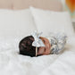 Baby wearing Copper Pearl Classic Nylon Bow Headband - Lacie