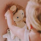 Girl brushing doll with Olli Ella Dinkum Doll Brush