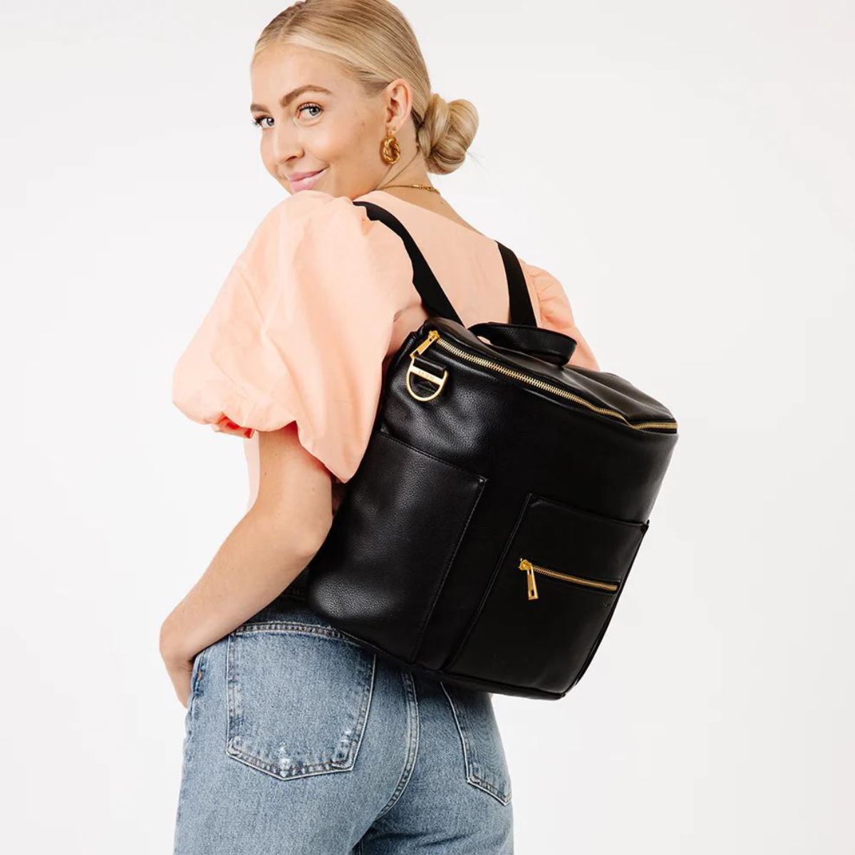 Woman wearing Fawn Design Original Diaper Bag - Black