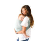 Woman carrying Child in Kyte BABY Ring Sling - Willow with Rose Gold Rings