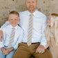 Father sits with daughter and son who is wearing Boon Ties Boys' Tie - La Jolla