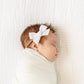 Baby wears Lou Lou and Company Linen Bow Headband - Medium - White