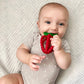 Baby chewing on RaZbaby RaZberry Bites Teething Toy - Red