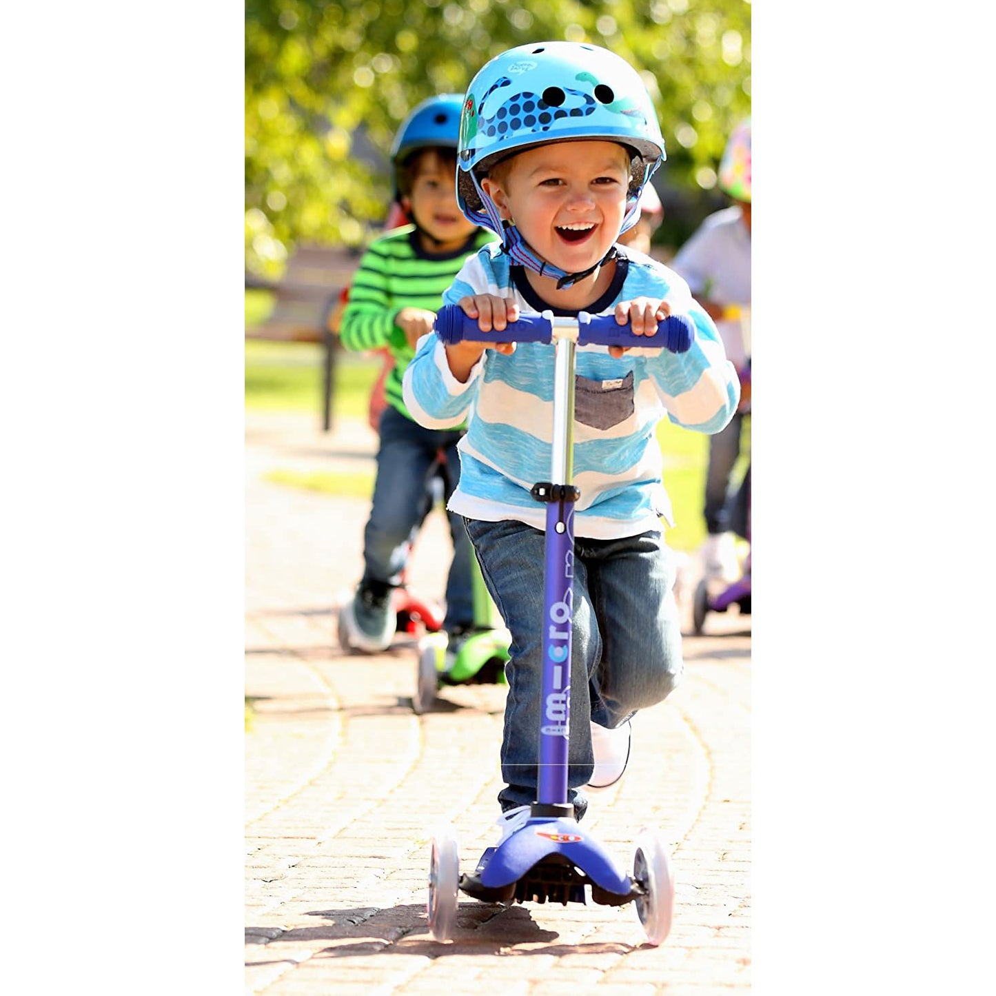 Little boy riding Micro Kickboard Mini Deluxe - Blue