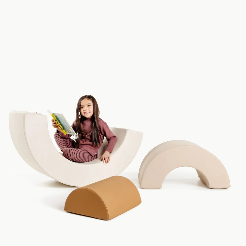 Girl sits on Gathre Arc Playset - Millet