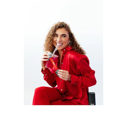 Woman Drinking Mixhers Herlove Libido Booster Dietary Supplement - 30 Sticks - Passionfruit / Apple / Huckleberry