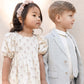 Boy wearing Noralee Sebastian Blazer - Chambray stands next to girl in dress