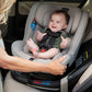 Woman looks at baby in Nuna REVV Rotating Convertible Car Seat