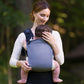 Mom carrying baby in Nuna CUDL Clik Carrier - Denim