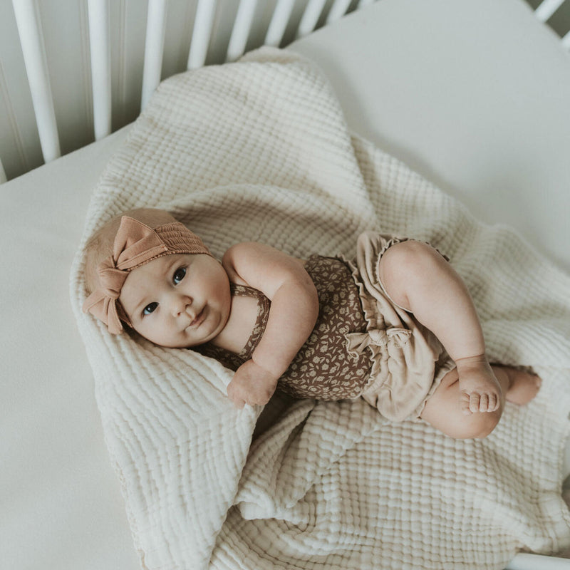 Baby wearing Lovedbaby Ruffle Bloomer - Oatmeal