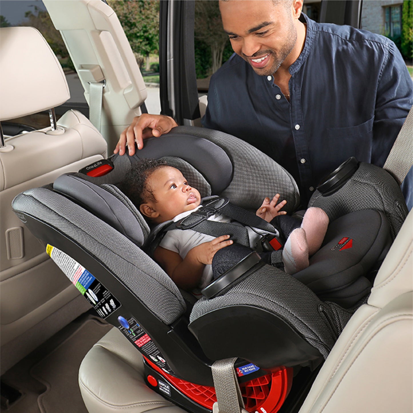 Father looks at baby in Britax One4Life ClickTight All-In-One Car Seat - Drift Gray