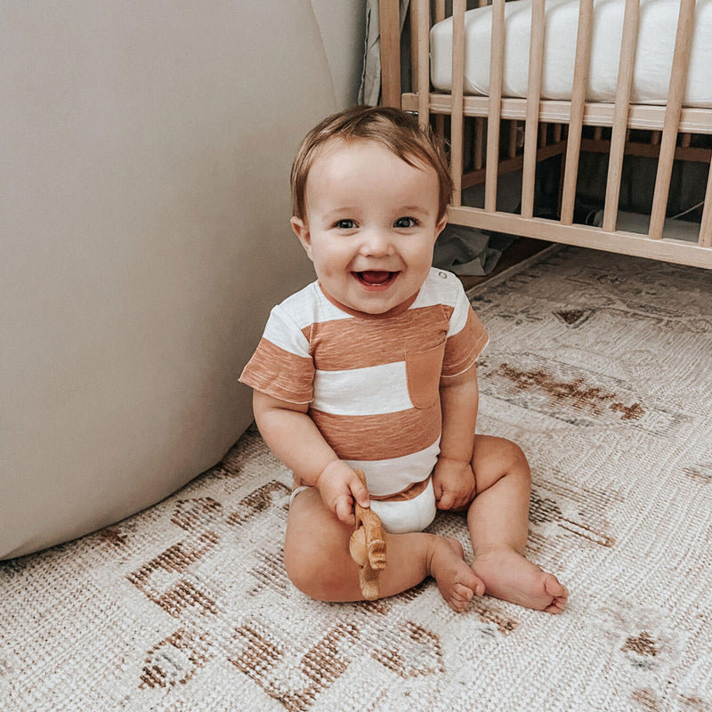 Baby boy wears Lovedbaby Slub Jersey Crewneck Bodysuit - Adobe Stripe