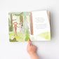Child pointing to page in Slumberkins Bigfoot Kin - Maple / Brown book