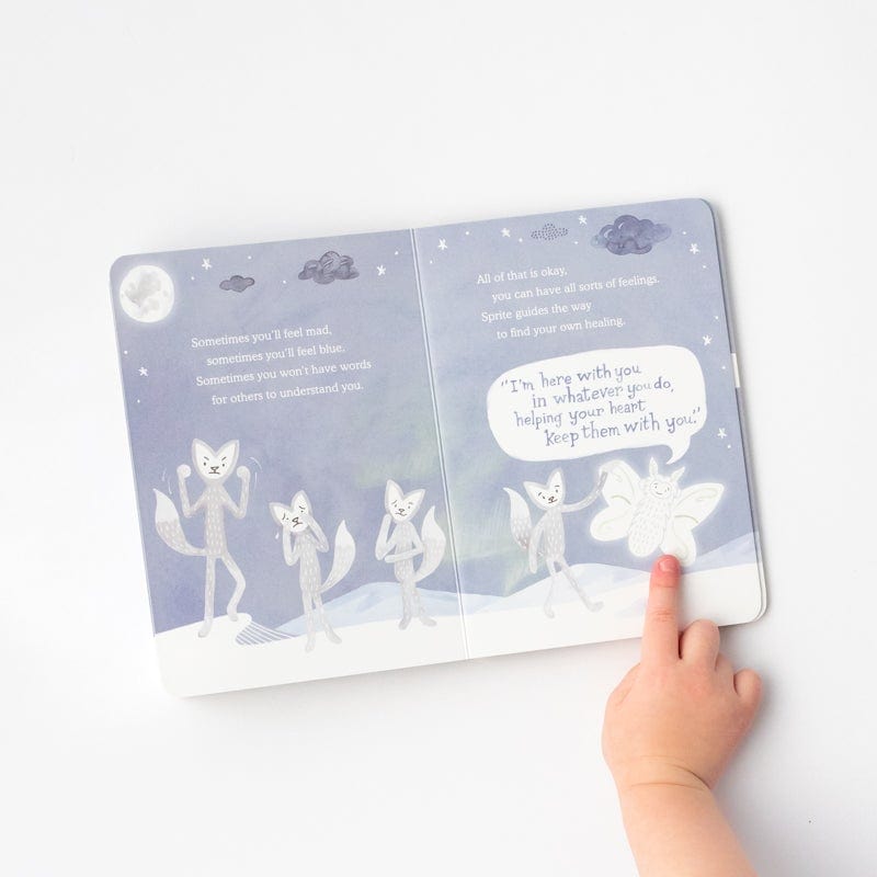 Child points to page in Slumberkins Board Book - Sprite Offers Comfort: A Lesson in Grief & Loss