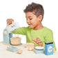 Boy plays with Tender Leaf Toys Mini Chef Home Baking Set