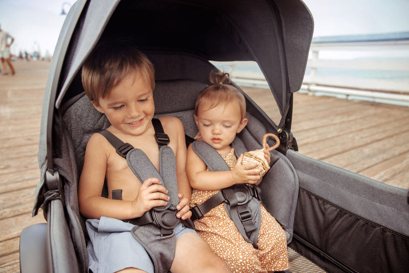 Kids in Veer Cruiser with Veer Cruiser XL Retractable Canopy - Heather Gray