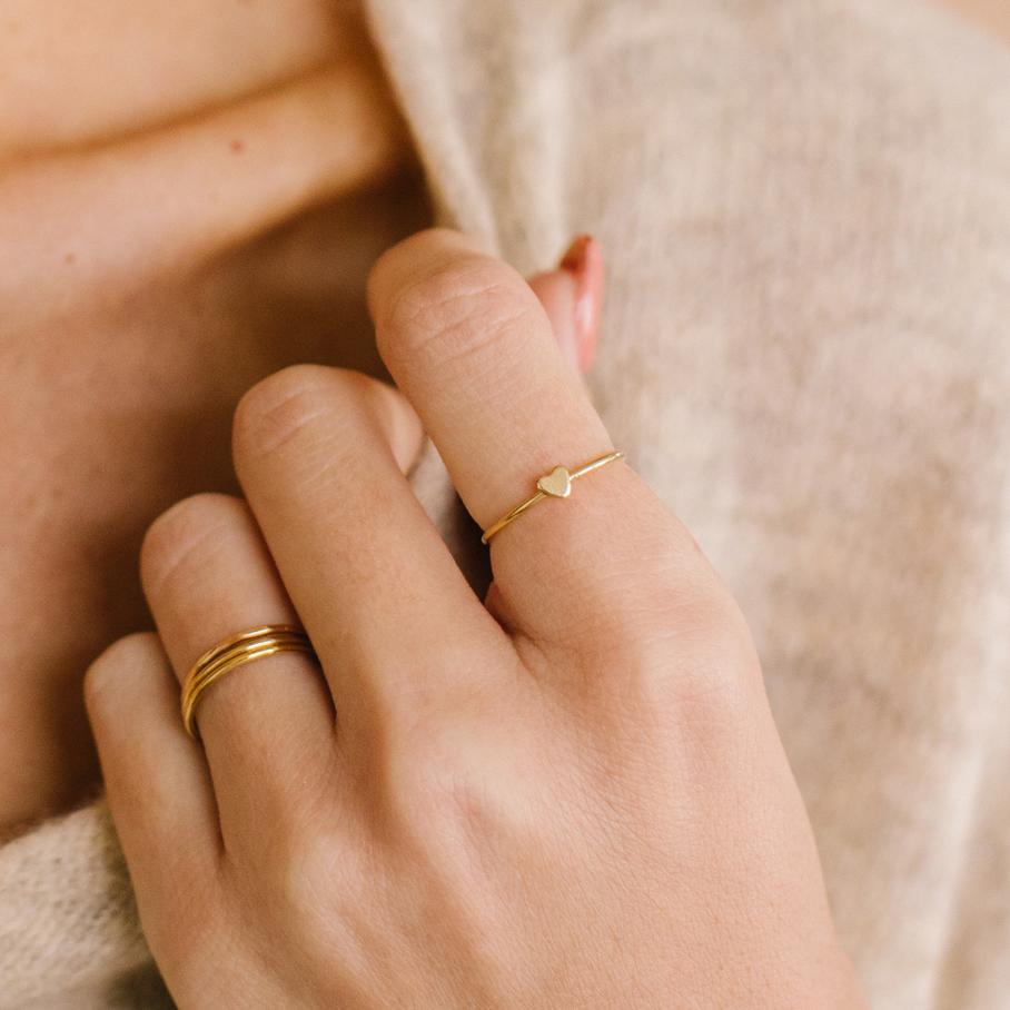Woman Wearing Made by Mary Gold Filled Heart Stacking Ring