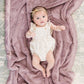 Baby laying on Saranoni Receiving Lush Blanket - Bloom