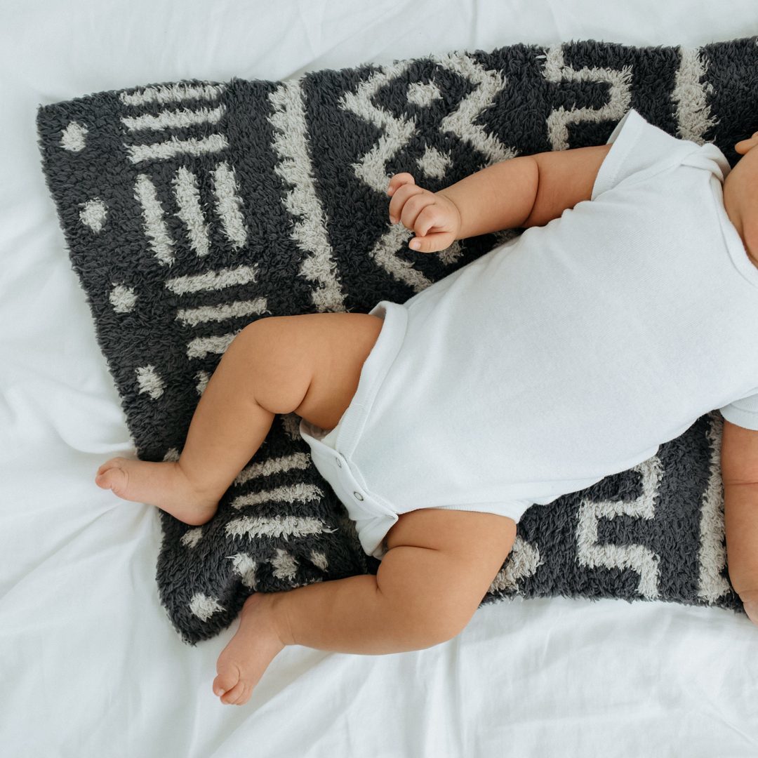 Baby Laying on Saranoni Mini Double-Layer Bamboni Blanket - Mudcloth