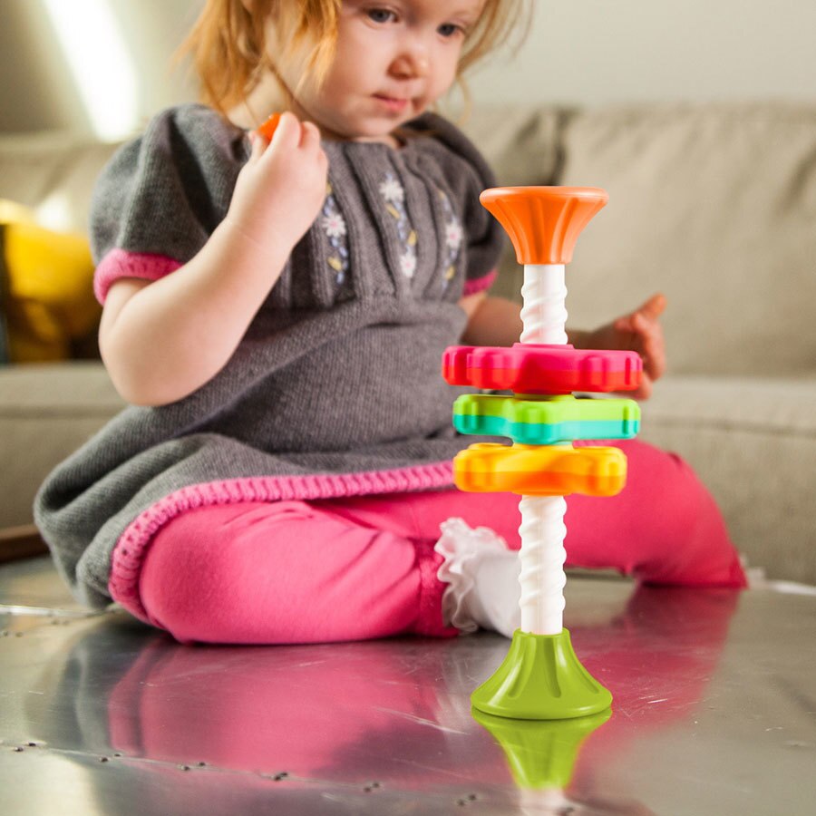 Child Playing with Fat Brain Toys MiniSpinny