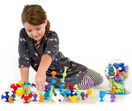Child Playing with Fat Brain Toys Squigz Deluxe Toy Set