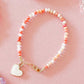 LittleLundsCo Baby Bracelet - Pink Coral Mix with White Heart Charm