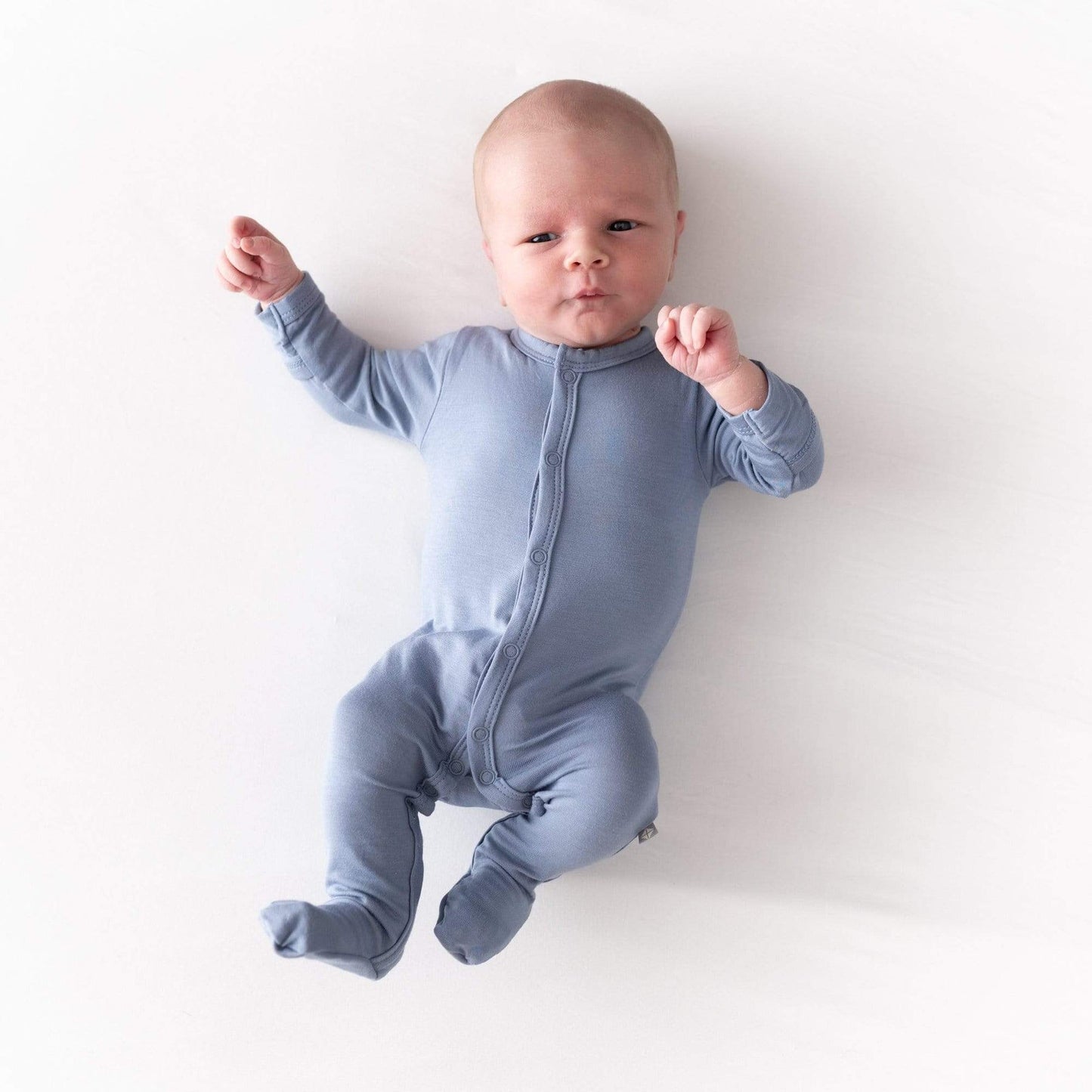 Baby wearing Kyte BABY Zippered Footie - Slate 