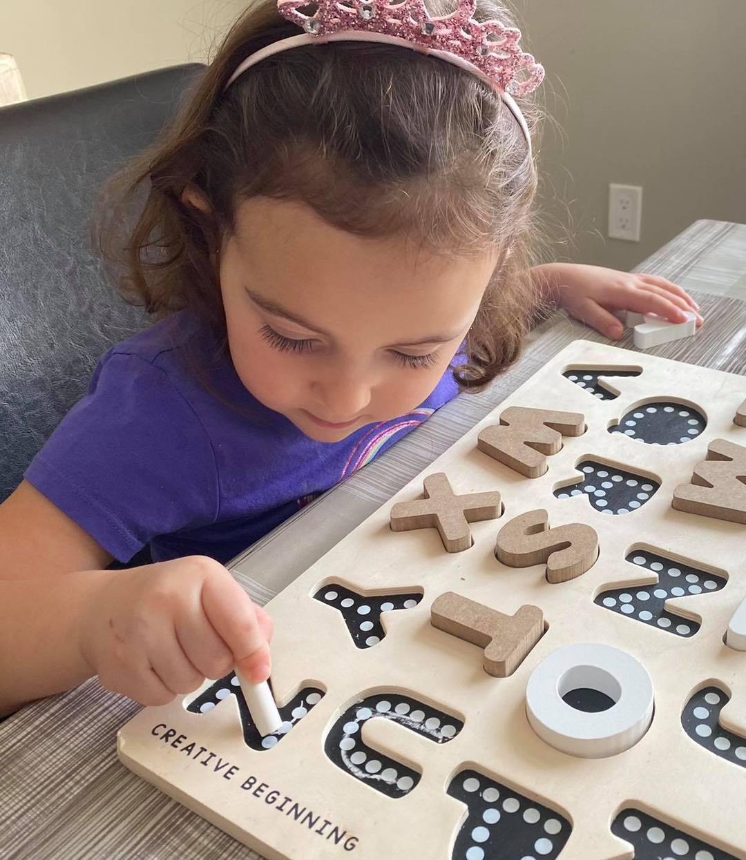 Child Playing with Creative Beginning Chalkboard Base Alphabet Puzzle