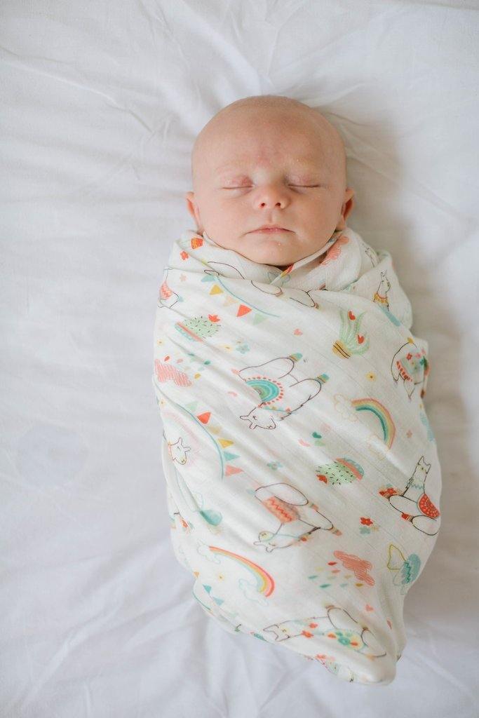 Baby swaddled in Loulou LOLLIPOP Muslin Swaddle Blanket - llama