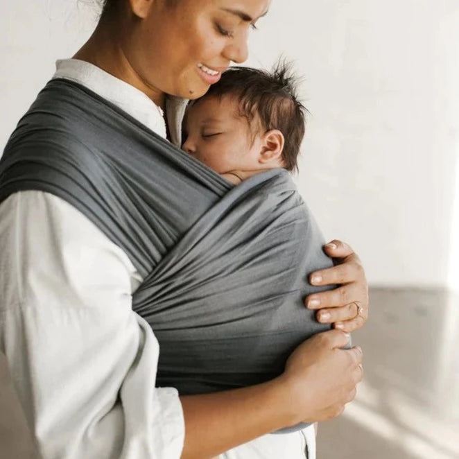 Woman wearing baby in Solly Baby Wrap - Orion
