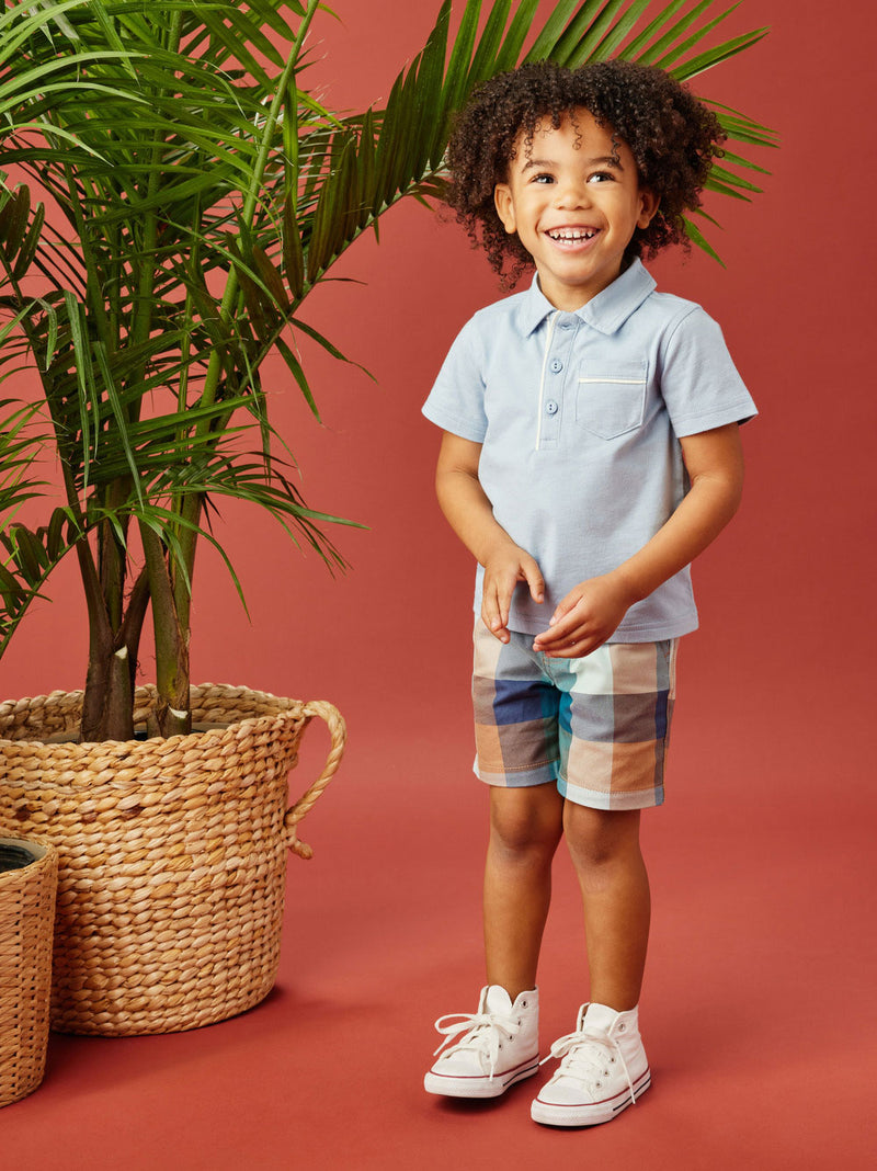 Little boy wears Tea Collection Piped Polo - Blue Fog