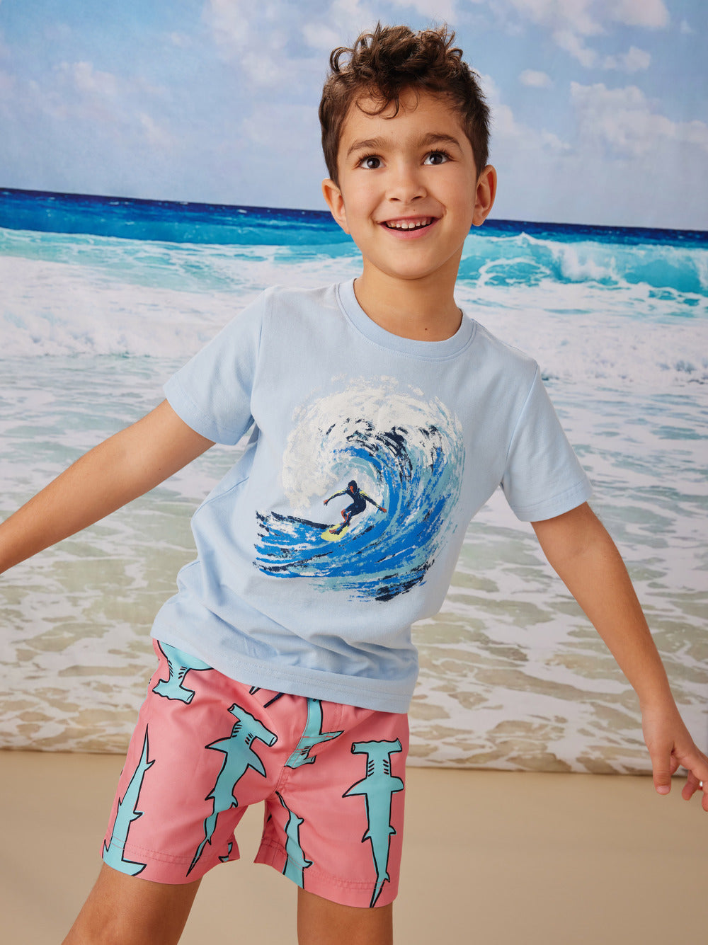 Little boy wears Tea Collection Shortie Swim Trunks - Hammerhead Sharks