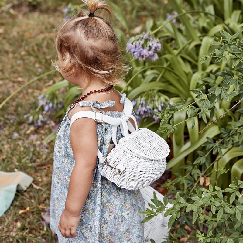 Toddler wearing Olli Ella Mini Chari Bag - White