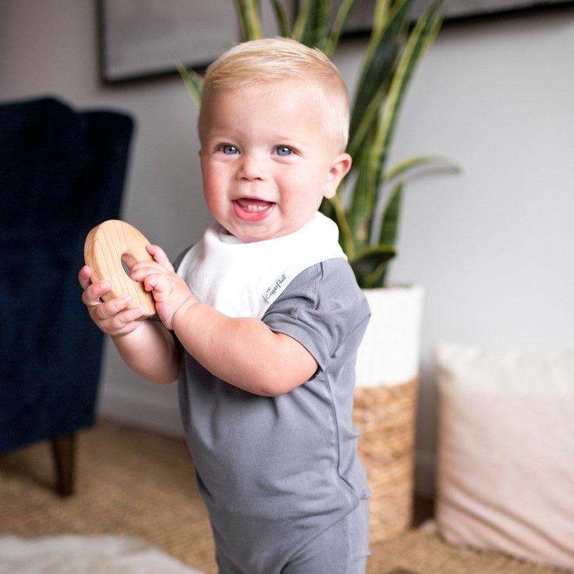 Toddler wearing Copper Pearl Single Baby Bandana Bib - White