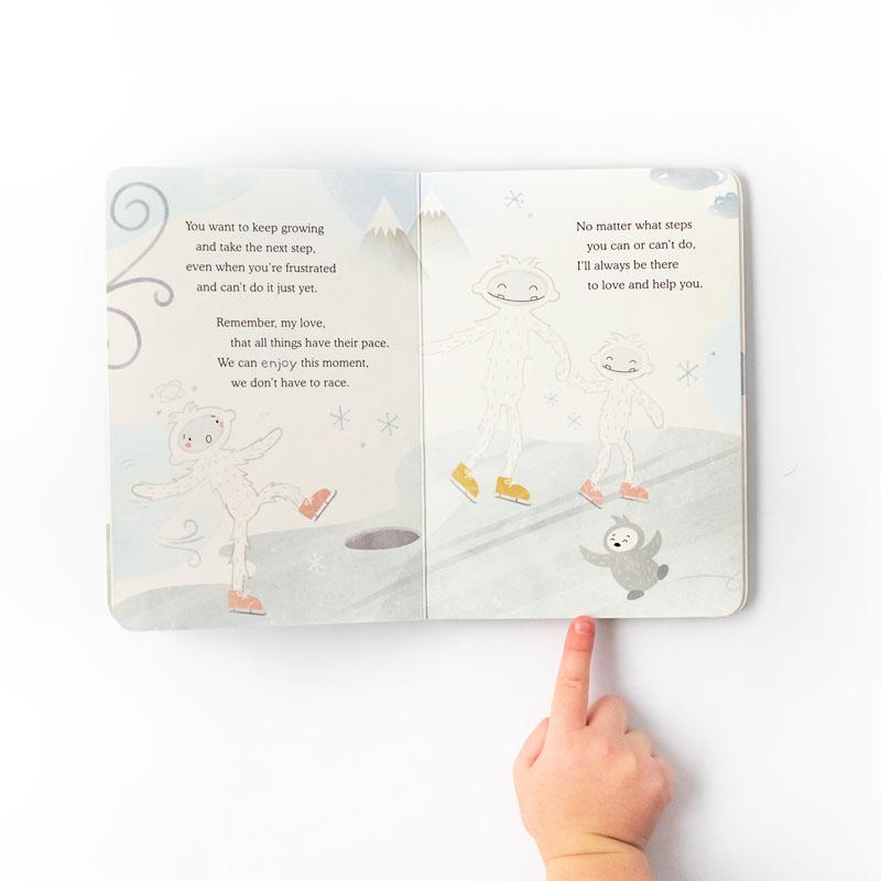 Child points to a page in Slumberkins Board Book - Yeti Greets the World: An Introduction to Mindfulness